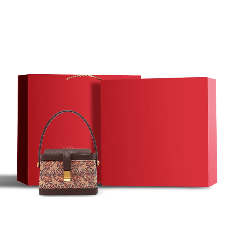 Velvet-lined red gift box for silk artistry bag.