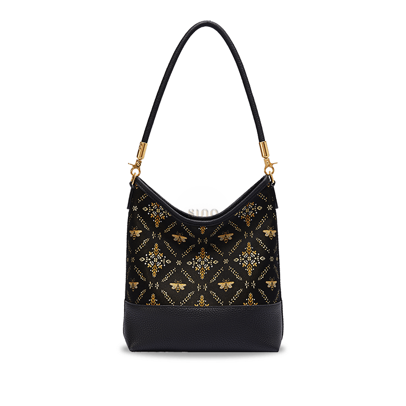 Black Shu Brocade Gilded Jade leather shoulder bag with golden bee and floral motifs.