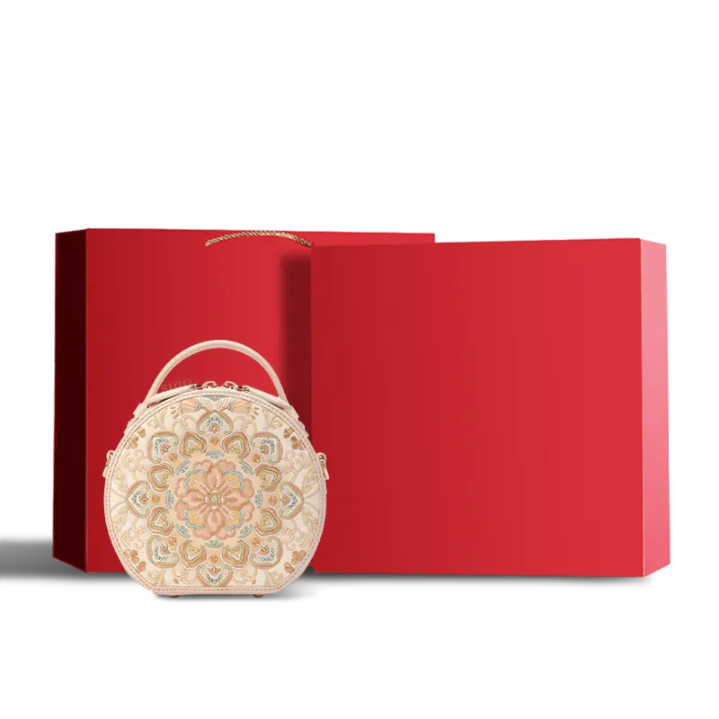 Red velvet-lined gift box with luxury handbag.