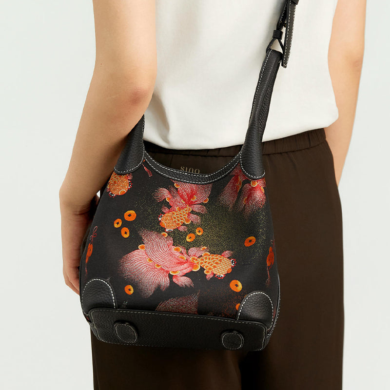 Back model view of the Chinoiserie Luxury Song Brocade Golden Carp Leather Basket Tote Bag, showing the golden carp motif, black leather trim, and structured basket tote shape.