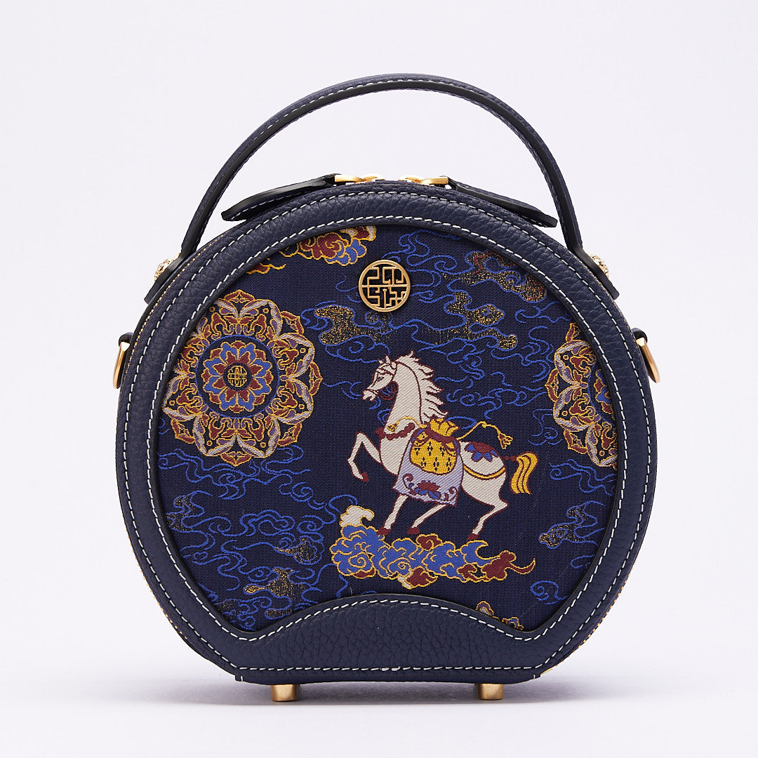 Front view of Chinoiserie luxury Song brocade round bag with horse-year blessings motif on white background.