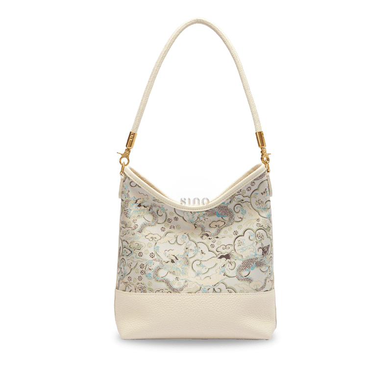 Front view of the Chinoiserie Luxury Song Brocade Ox-Head Dragon Leather Shoulder Bag with elegant ivory leather and traditional brocade dragon pattern.