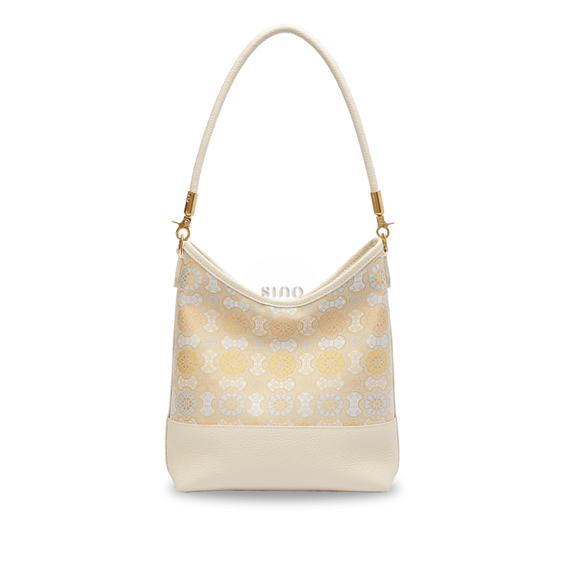 Front view of the Chinoiserie Luxury Song Brocade Ruyi Victory Leather Shoulder Bag featuring elegant ivory leather and a traditional Song brocade Ruyi pattern.