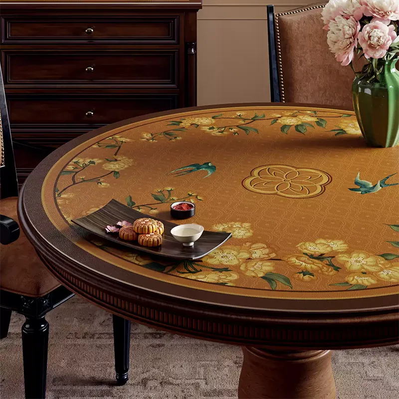Round table mat with left floral swallow pattern.