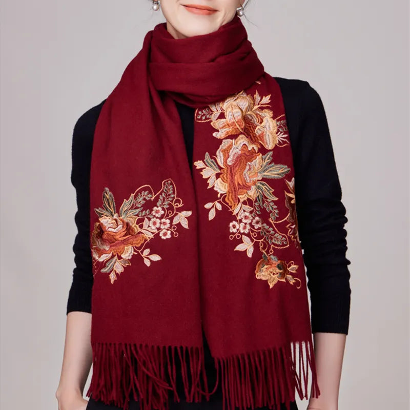 Model wearing luxury 100% wool cashmere scarf with prosperous peony chinoiserie embroidery in burgundy.