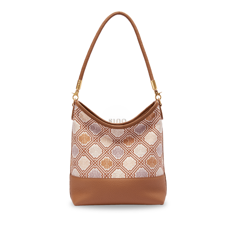 Front view of the Chinoiserie Luxury Zhuang Brocade Chrysanthemum Meander Leather Shoulder Bag with brown leather trim and geometric floral motifs.