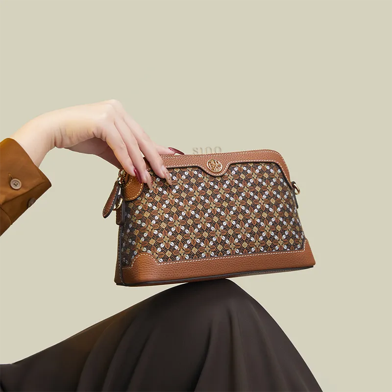 Model seated with the Osmanthus Motif clutch purse placed on the knees.