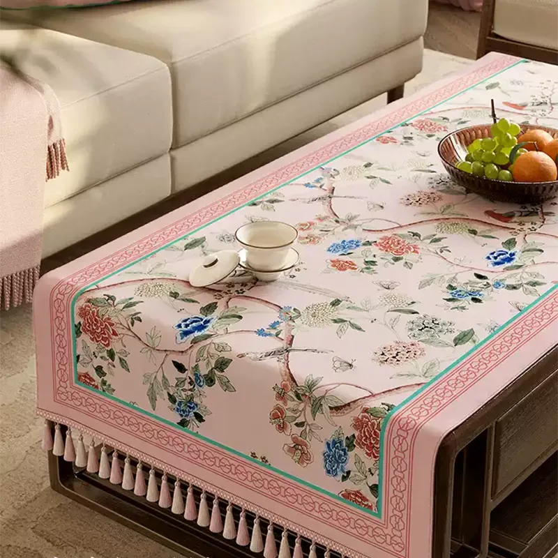 Full coverage pastel pink tablecloth on coffee table.