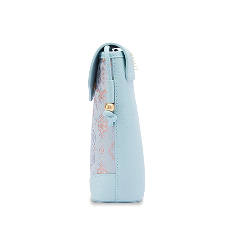 Chinoiserie cell phone crossbody bag side view showing its slim profile, leather construction, and compact silhouette.