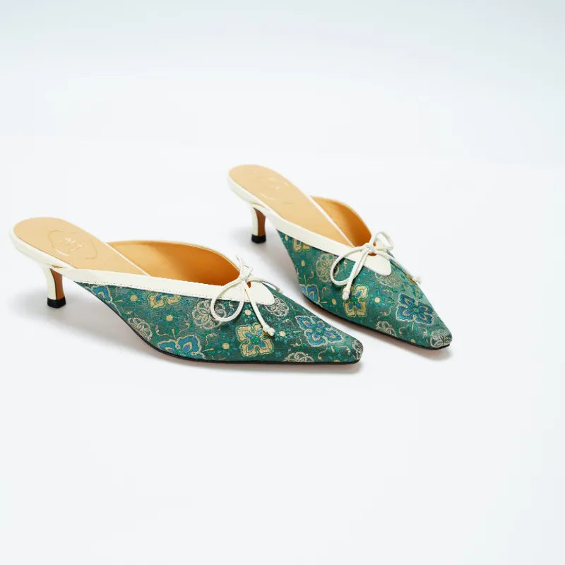 Chinoiserie Shu Brocade mules for women with elegant emerald woven patterns and kitten heels.