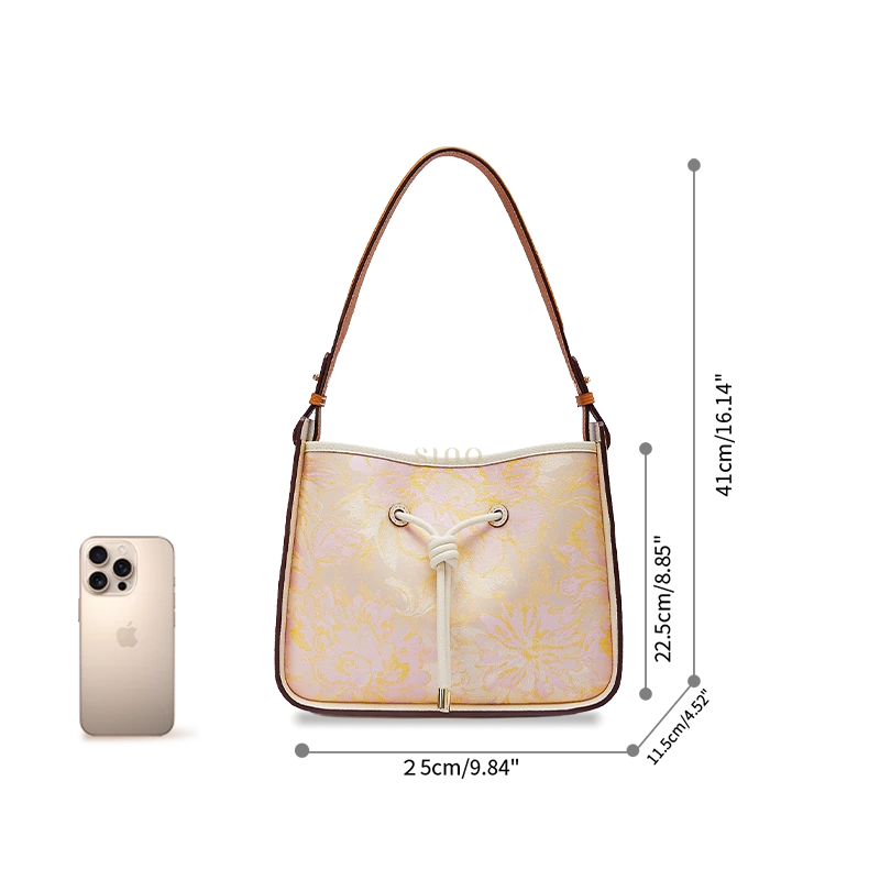 Peony Dream large shoulder bag size reference shown beside a smartphone for scale.