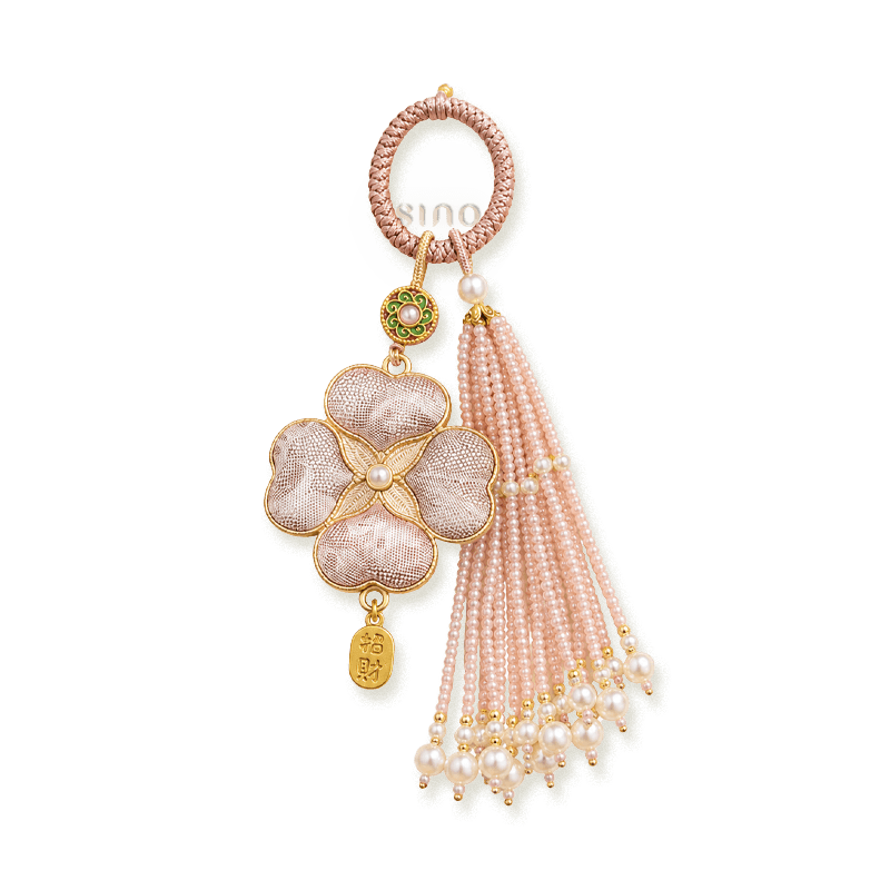 Pink Chinoiserie Song Brocade auspicious four-leaf clover tassel bag charm with pearl tassels, gold-tone trim, and a lucky pendant.