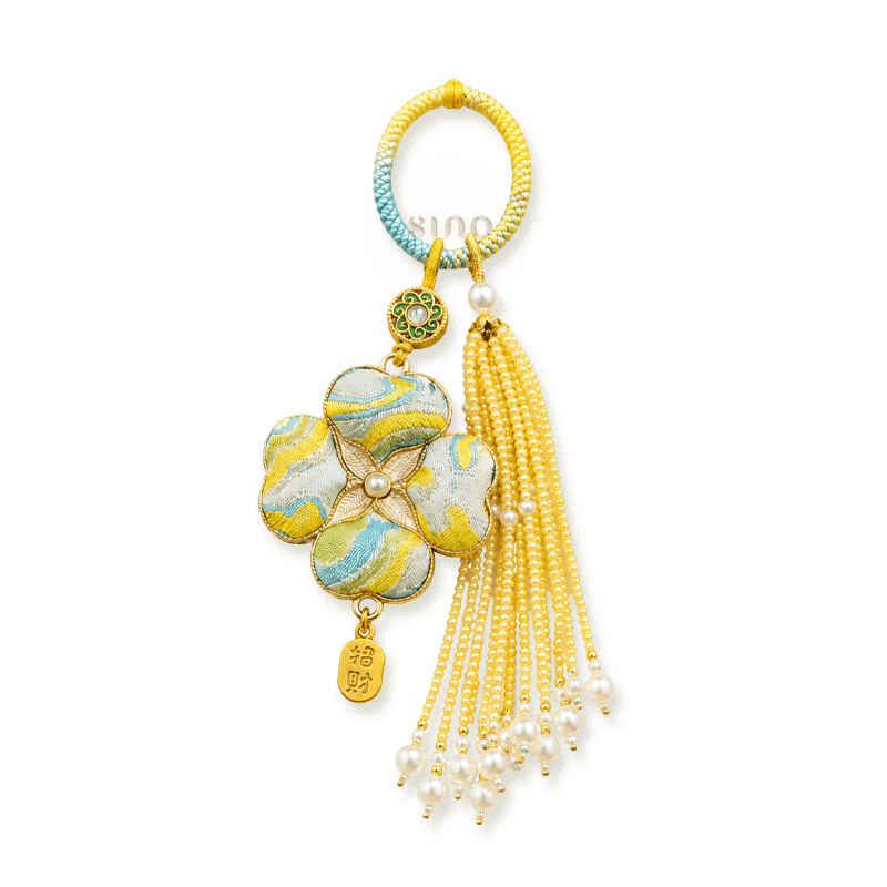 Yellow Chinoiserie Song Brocade auspicious four-leaf clover tassel bag charm with pearl tassels, gold-tone trim, and a lucky pendant.