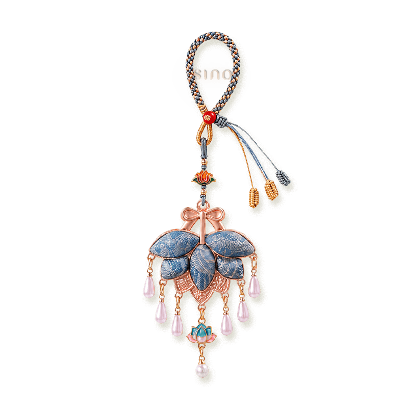 Blue Song Brocade pomelo leaf tassel bag charm with woven leaf details, rose-gold bow, lotus ornament, and pearl-like teardrop charms.
