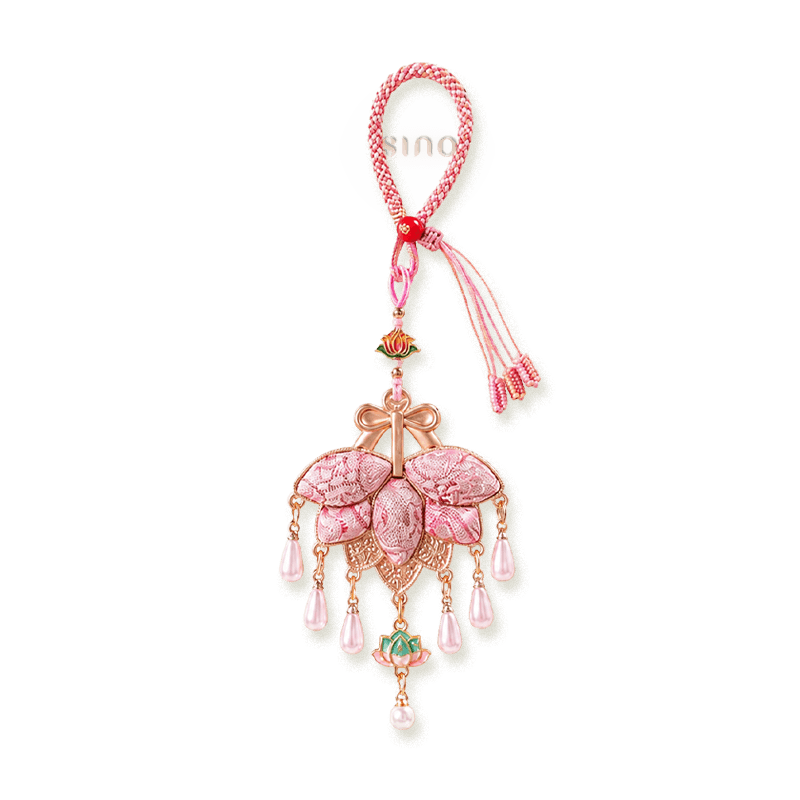 Pink Song Brocade pomelo leaf tassel bag charm with layered brocade leaves, rose-gold bow details, lotus accents, and pearl-like pendants.