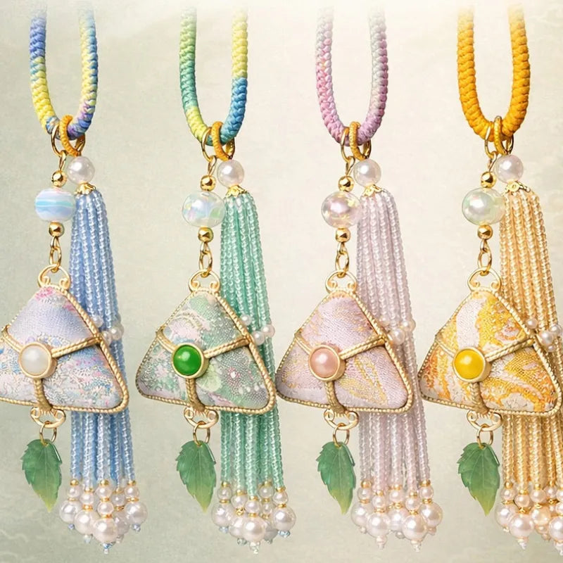 Chinoiserie Song Brocade auspicious zongzi tassel bag charms in four colors: blue, green, pink, and yellow.