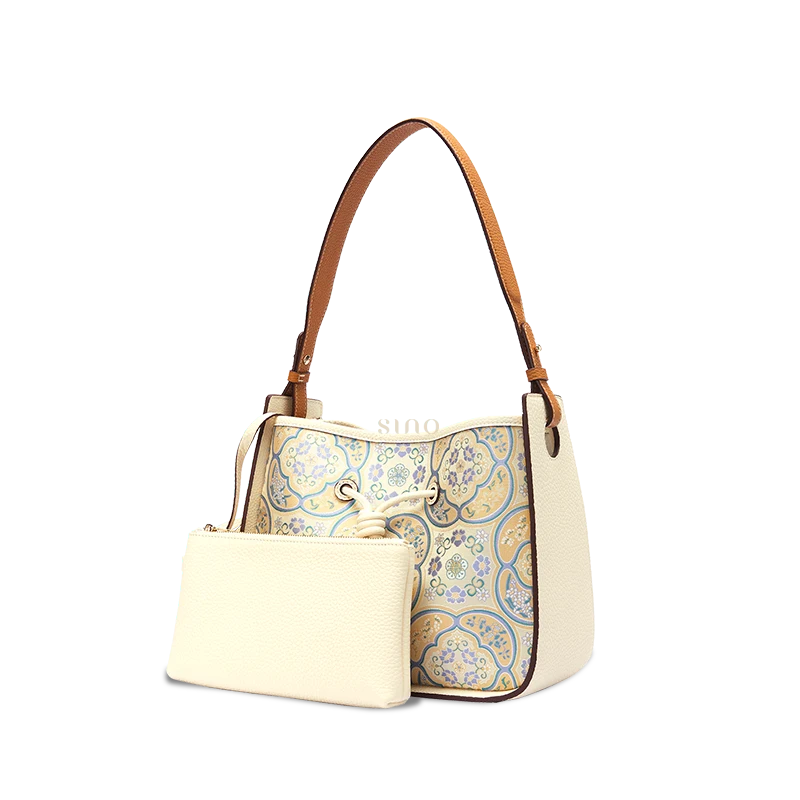 Chinoiserie leather shoulder bag for women with Seasonal Grace Song Brocade and matching pouch, angled front view.