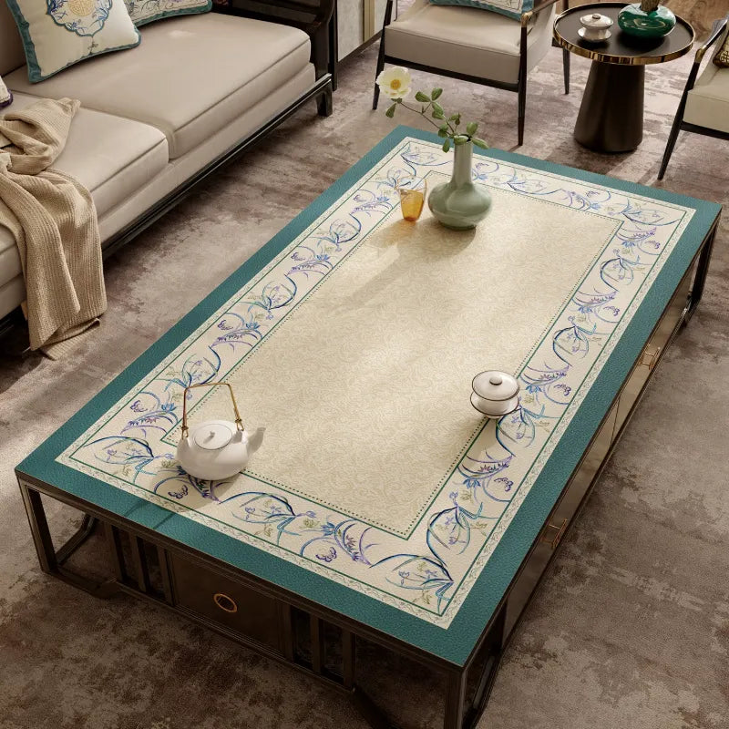 Summer blue leather coffee table mat with Chinoiserie floral border.