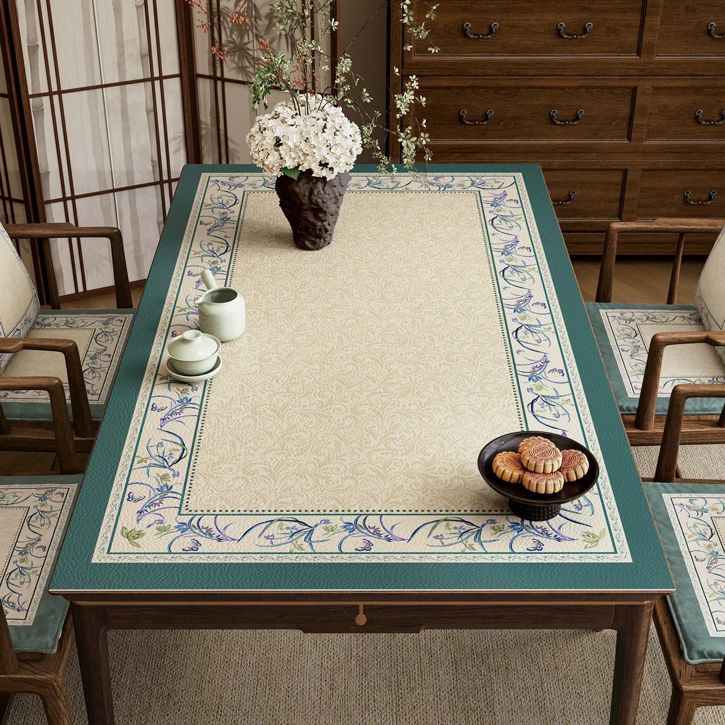 Chinoiserie summer blue leather table mat with floral border.