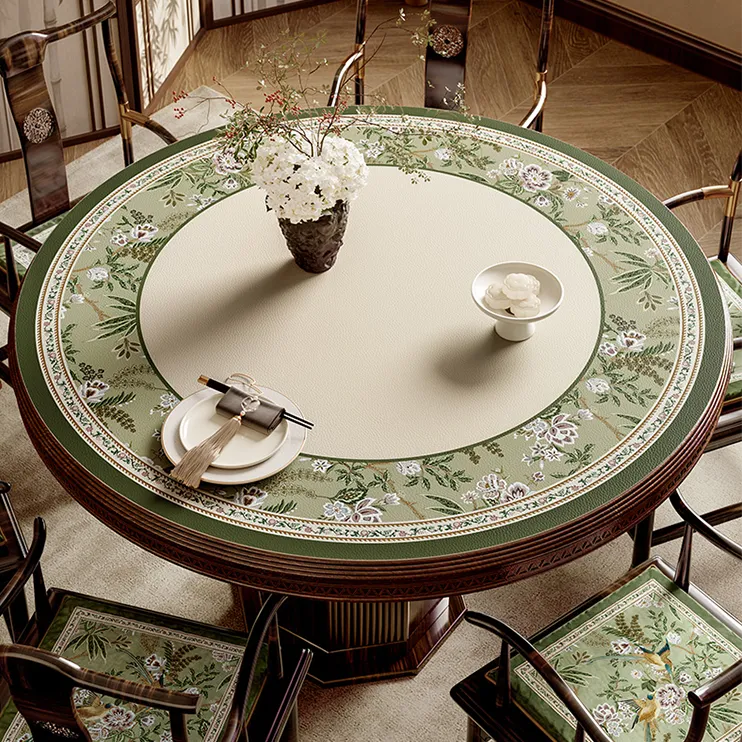 Chinoiserie-inspired round dining table setting in jade green for spring.