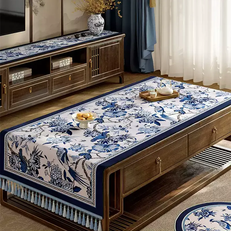 Blue and white vintage porcelain floral tablecloth on coffee table.