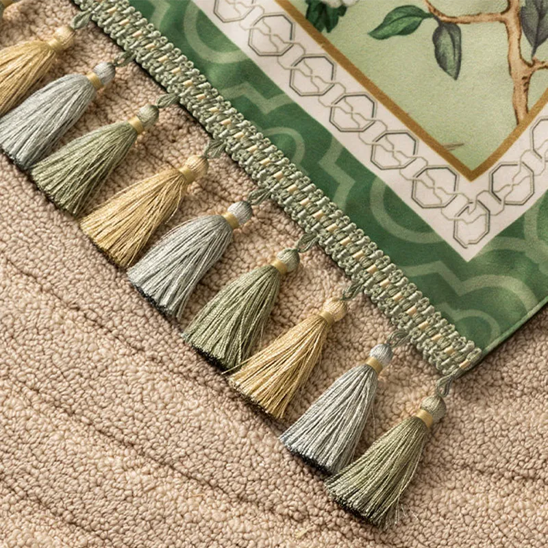 Close-up of the handmade tassel fringe on the jade green chinoiserie long table runner.