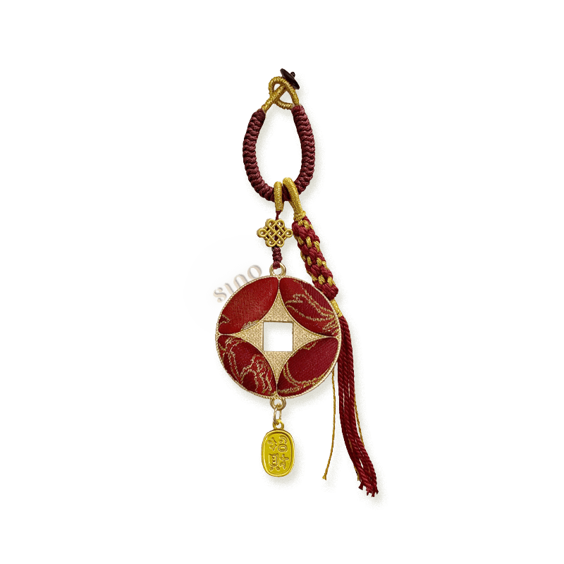 Red Chinese coin-shaped bag charm crafted from Yunjin brocade with gold-toned edging, a burgundy braided cord, tassel, and wealth pendant.