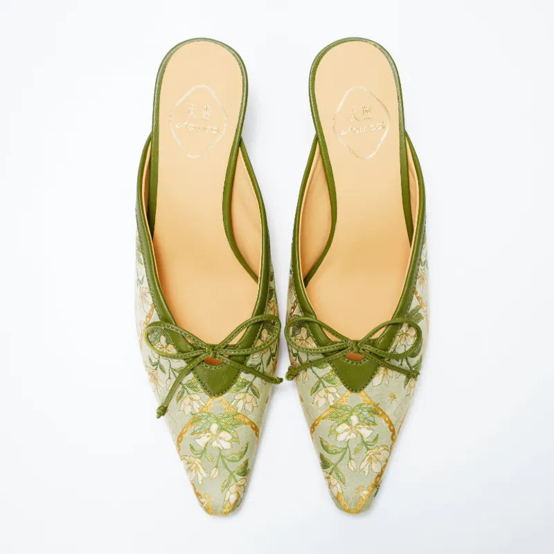 Detail view of Dayun Brocade kitten heel mules highlighting floral motif, leather trim, and handcrafted details.