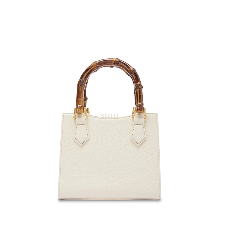 Bottom detail of Dayun Brocade Verdant Floral handbag showing durable leather base and handcrafted finishing.