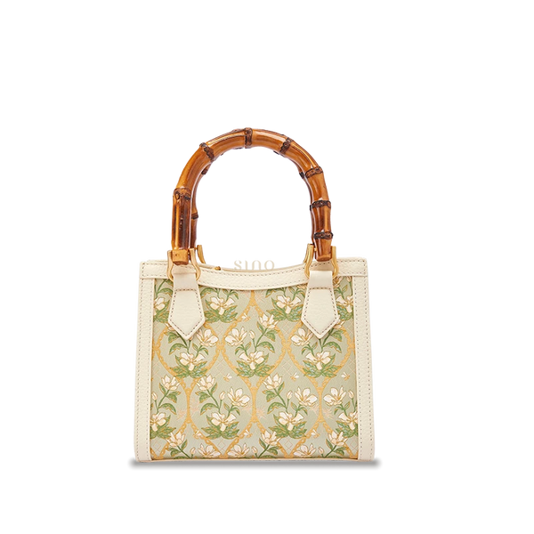 Dayun Brocade Verdant Floral leather bamboo handle handbag featuring traditional silk weaving, floral motifs, and refined handcrafted design.
