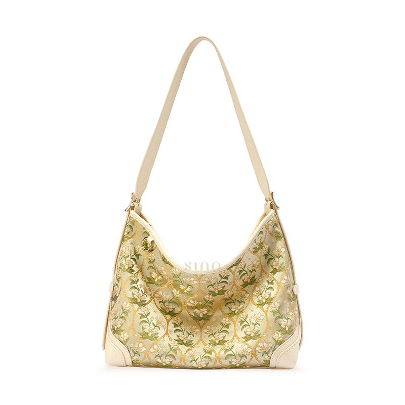 Front view of Chinoiserie Luxury Dayun Brocade Verdant Floral Leather Crossbody Bag, showcasing green floral pattern and leather details.