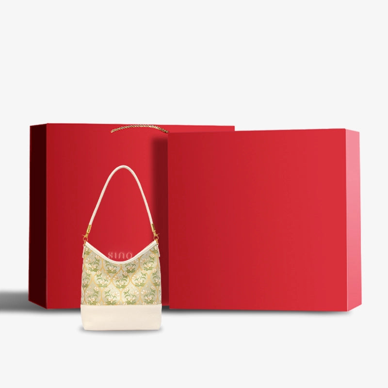 Chinoiserie Luxury Dayun Brocade Verdant Floral Leather Shoulder Bag displayed with elegant red gift box packaging.