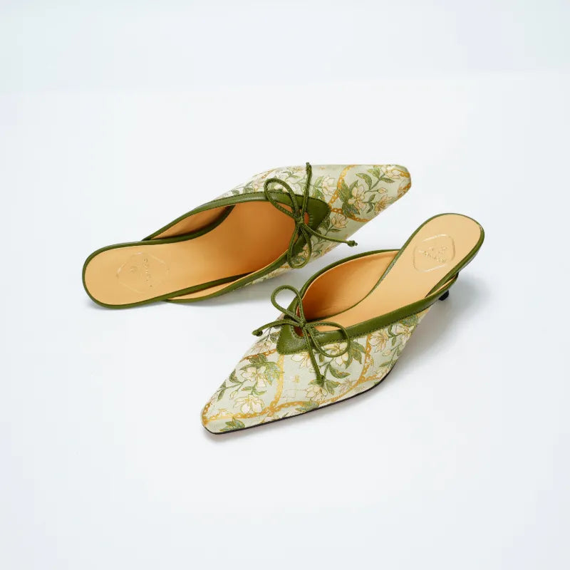Top view of Dayun Brocade Verdant Floral mules showing delicate woven patterns and open-back kitten heel style.