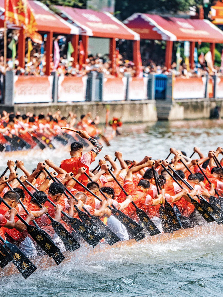 Diejiao dragon boat drifting race during the Dragon Boat Festival, featuring paddlers in a thrilling Chinese tradition and cultural spectacle on the water.