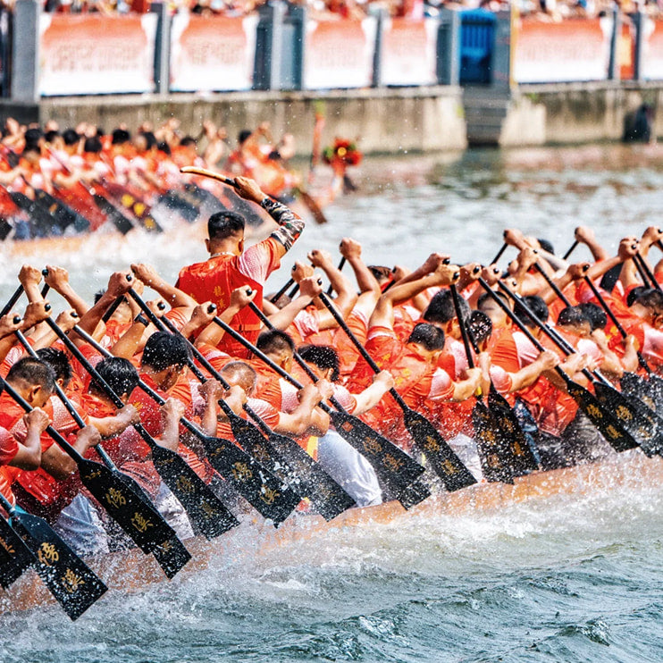 Diejiao dragon boat drifting race during the Dragon Boat Festival, featuring paddlers in a thrilling Chinese tradition and cultural spectacle on the water.