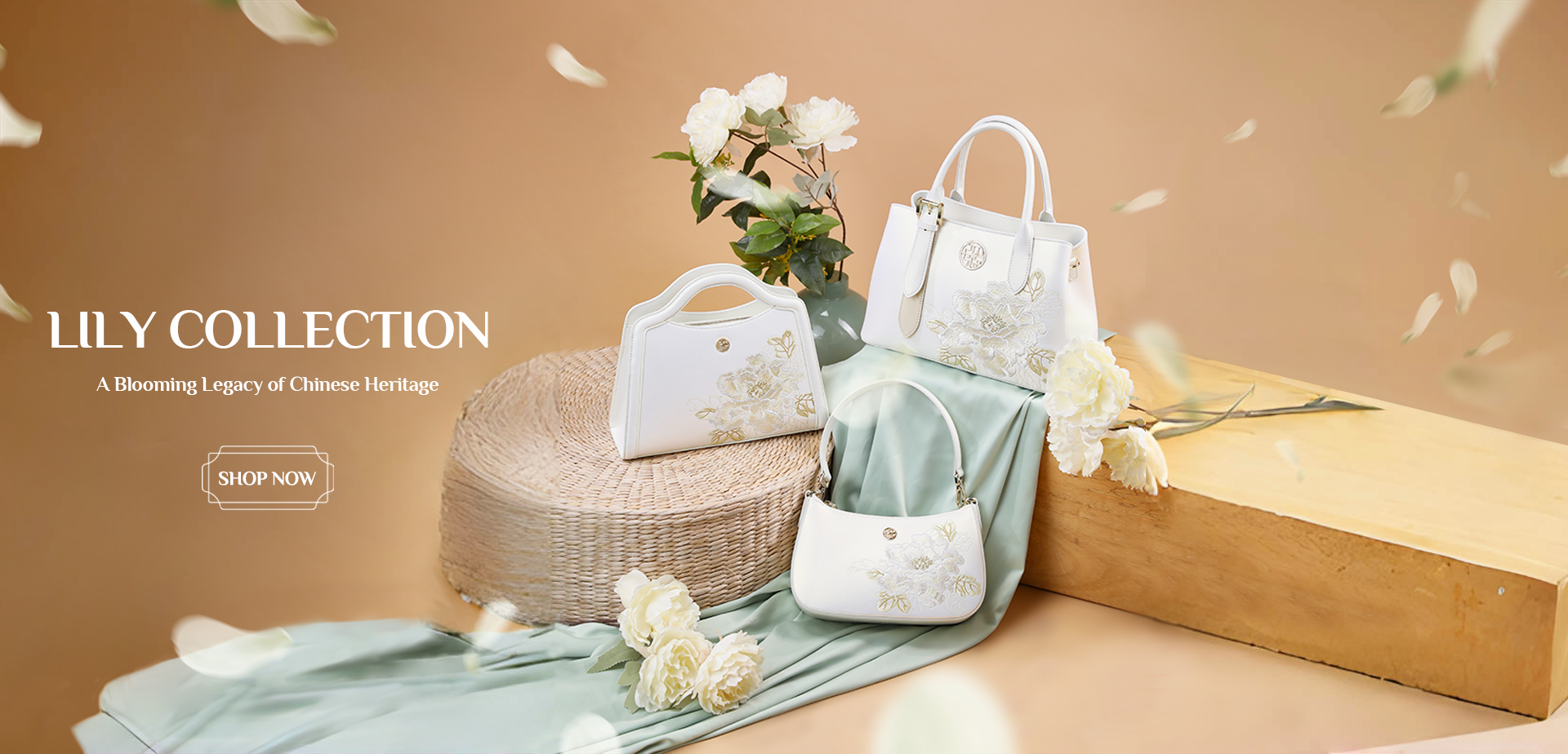 Sinocultural‘s Embroidered Lily Collection banner featuring three white handbags with lily embroidery, displayed on a woven mat and wooden block with white flowers, against a soft beige background.