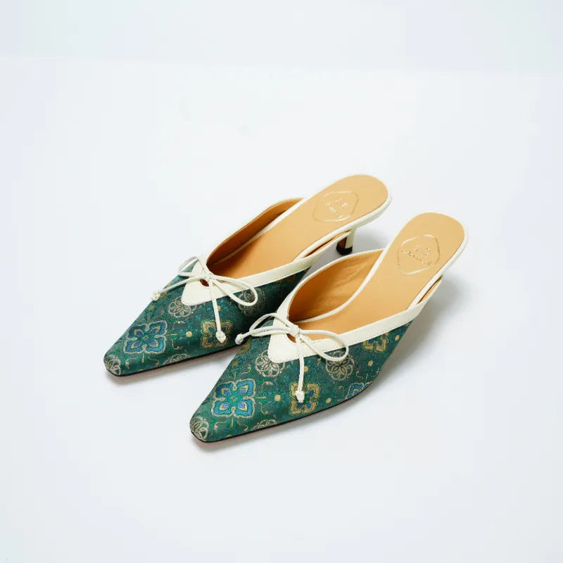 Emerald Shu Brocade pointed toe mule shoes with Ruyi Persimmon Calyx motif and elegant kitten heel.