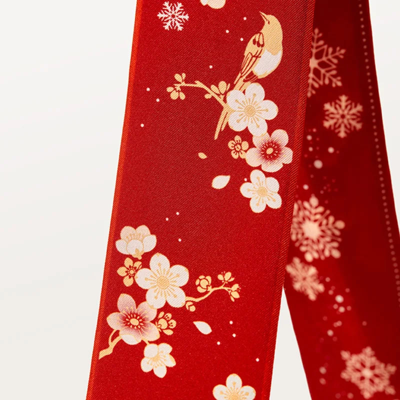 Detail of magpies, plum blossoms and snowflakes on the Chinese Forbidden City Print Mulberry Silk Twilly.