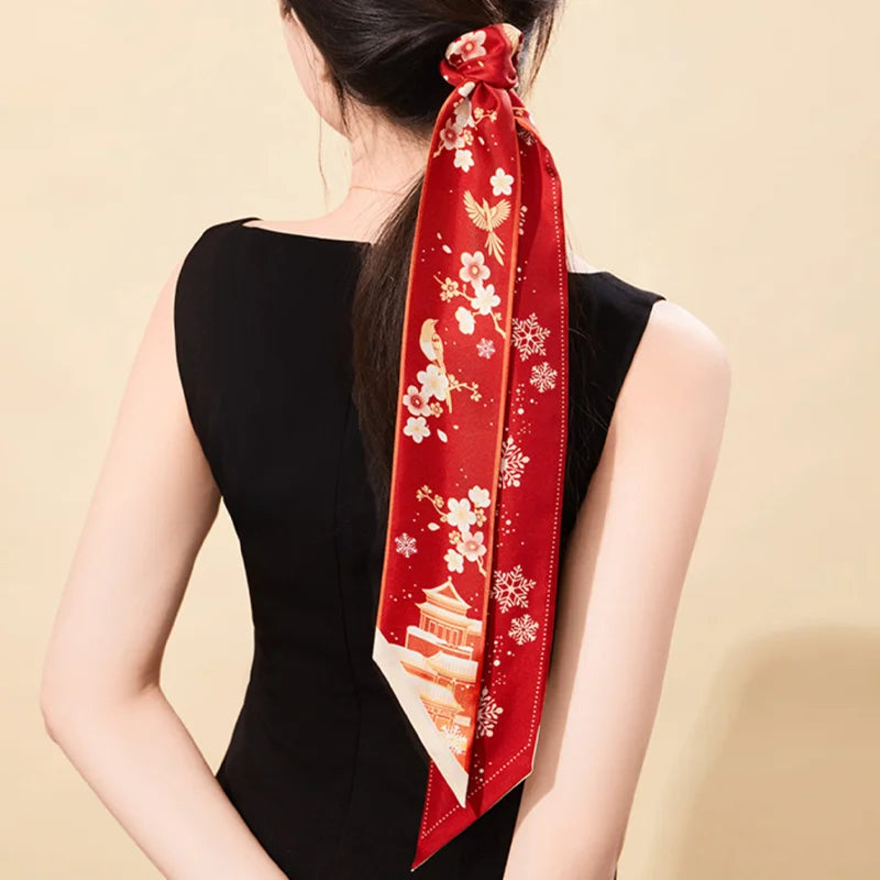 Forbidden City Snowfall & Magpie Mulberry Silk Twilly styled as an elegant ponytail hair scarf.