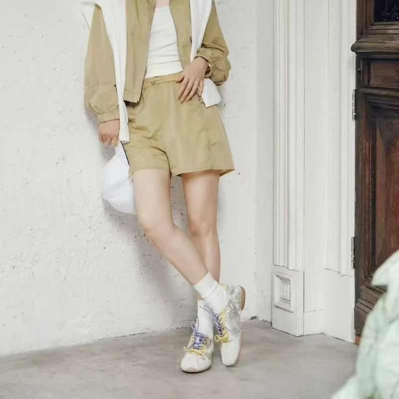 Women wearing Golden Yellow Shu Brocade Persimmon Motif ballet sneakers, showing a casual Oriental-inspired everyday outfit.