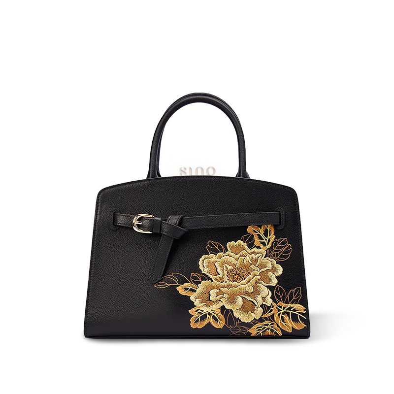Luxury black peony embroidered leather top handle bag with gold floral embroidery front view.