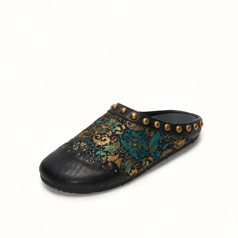 Luxury black silk brocade mules for women with traditional craftsmanship and modern silhouette.