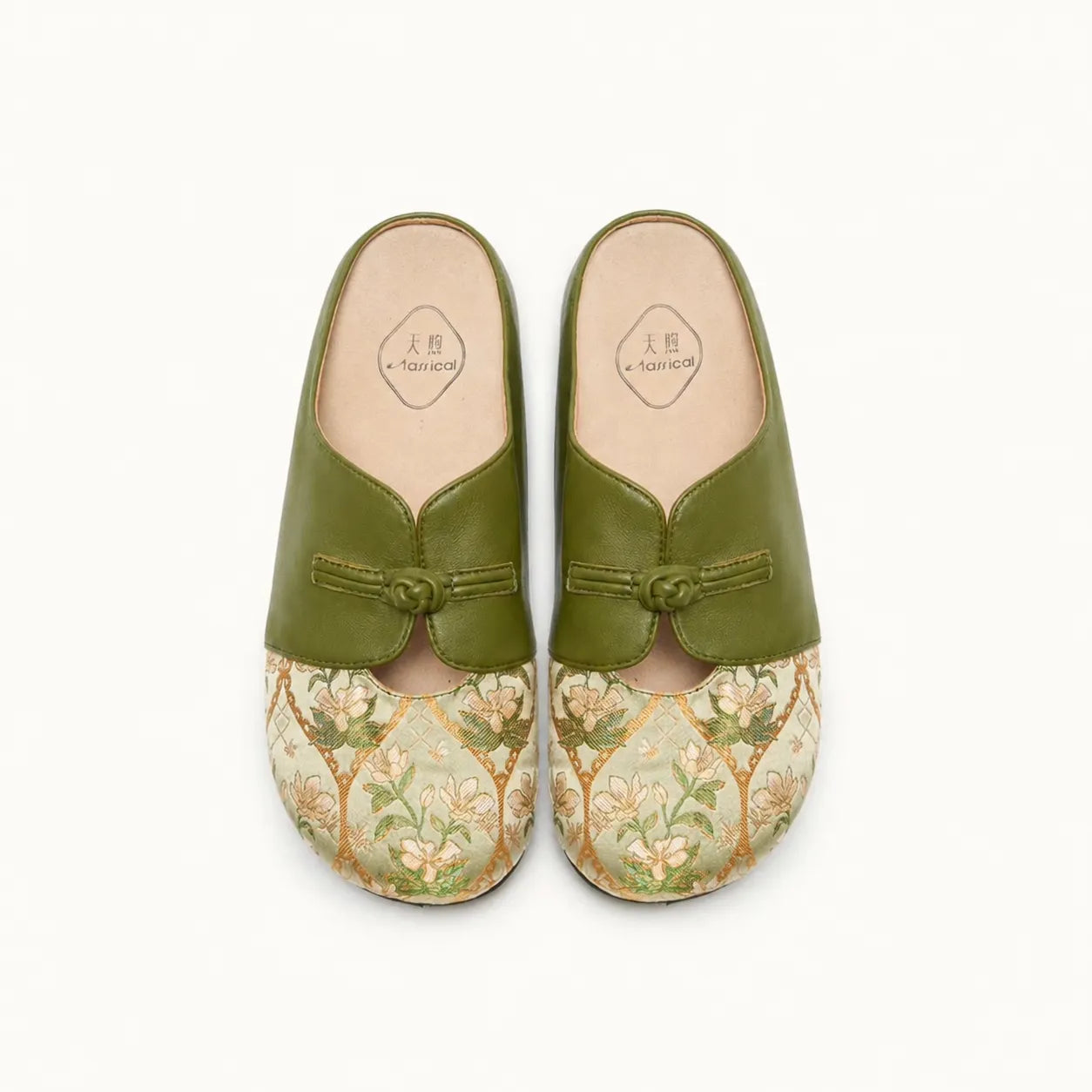 Front view of luxury green Dayun Brocade mules for women with delicate floral brocade uppers.