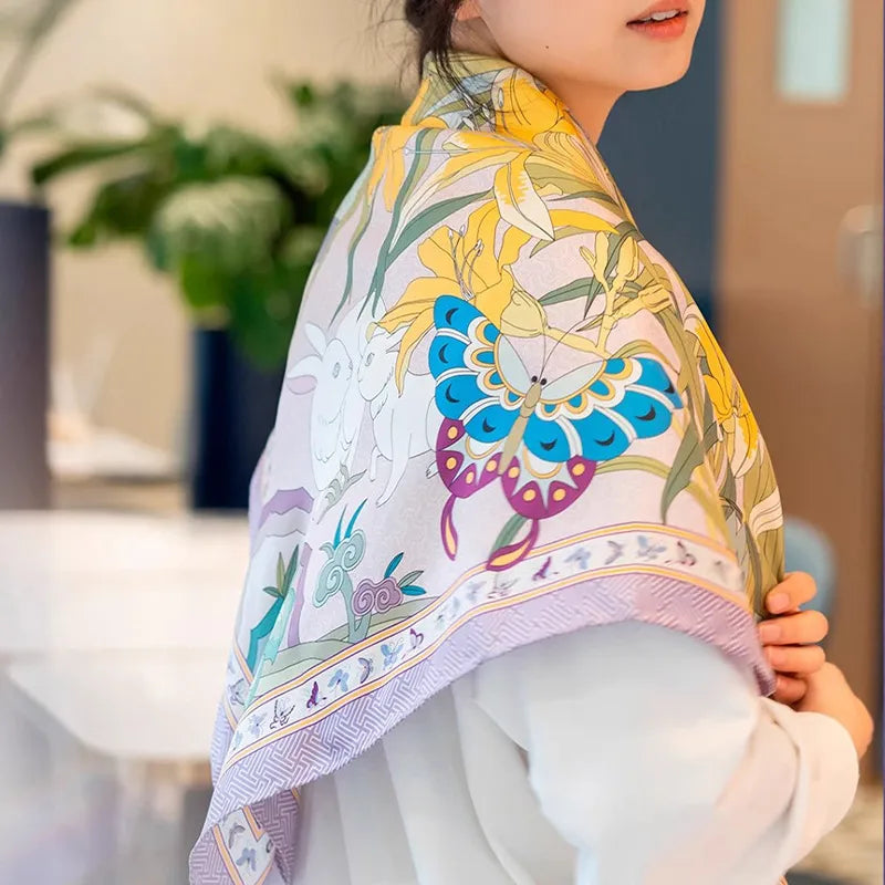 Model wearing a Luxury Nanjing Brocade Garden Butterfly mulberry silk square scarf draped over the shoulders, featuring butterfly, flower, and rabbit details.