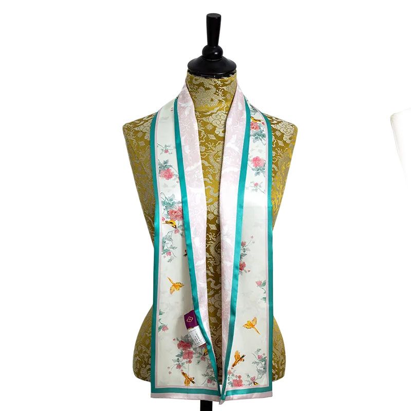 Luxury Nanjing Brocade Peony & Bird mulberry silk square scarf displayed on a mannequin, showing the green-edge peony and bird print.