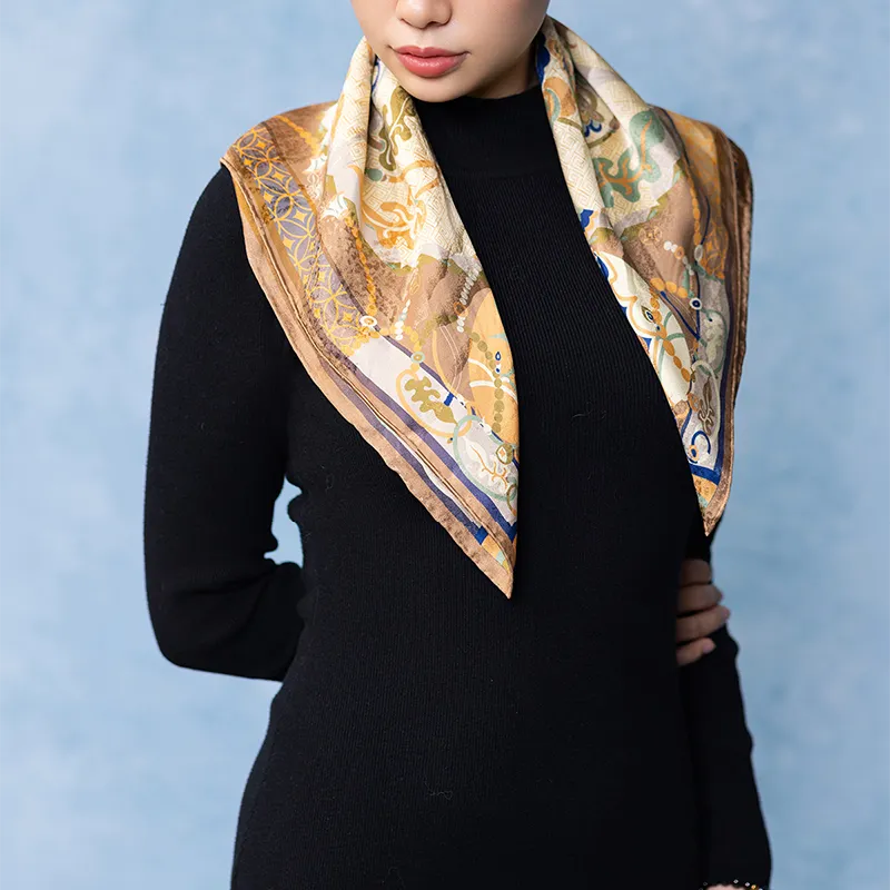 Model wearing a Luxury Nanjing Brocade Pomegranate Grape Motif mulberry silk square scarf draped over a black top.