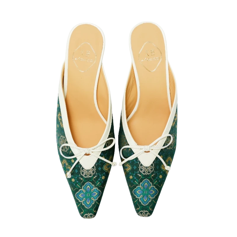 Transparent top view of Luxury Shu Brocade Emerald Ruyi kitten heel mules for women featuring emerald green brocade fabric, Chinese ruyi motifs, pointed toes, bow details, and elegant Oriental craftsmanship.