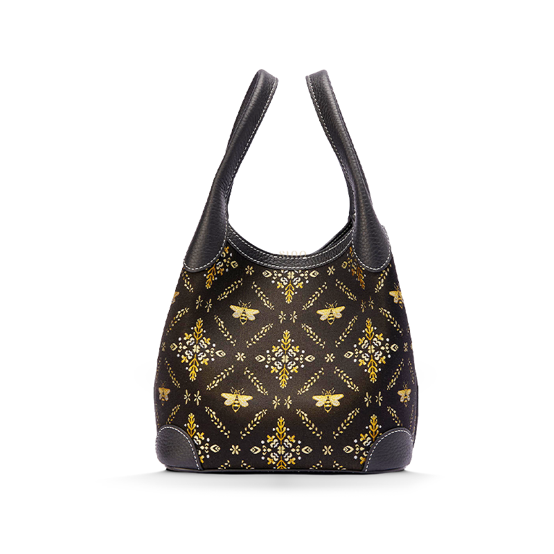 Front view of the Luxury Shu Brocade Gilded Jade Leather Basket Tote Bag, featuring a black brocade body with gilded bee and botanical motif.