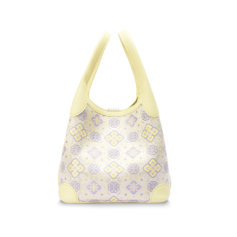 Front view of the Luxury Shu Brocade Persimmon Calyx Motif Basket Tote Bag, featuring a soft yellow leather trim and woven persimmon calyx pattern.