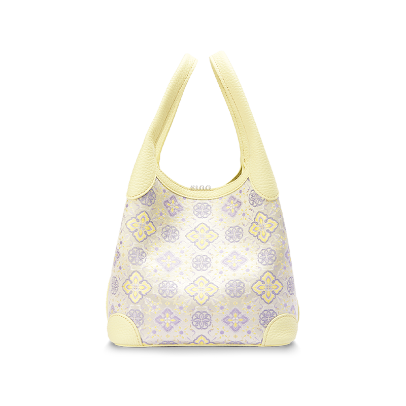 Front view of the Luxury Shu Brocade Persimmon Calyx Motif Basket Tote Bag, featuring a soft yellow leather trim and woven persimmon calyx pattern.